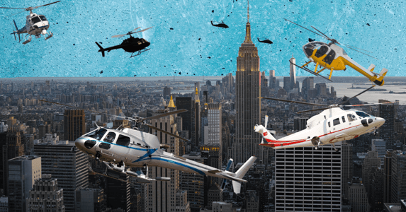 The New York City skyline with multiple helicopters flying overhead.